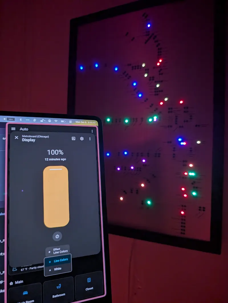 The Metroboard lit up on a wall, next to a Home Assistant dashboard showing its light controls